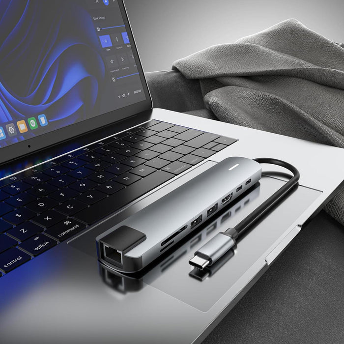 Laptop with a USB hub on a desk