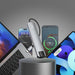 Multiple electronic devices including a laptop, smartphone, and tablet with charging cables on a dark background.